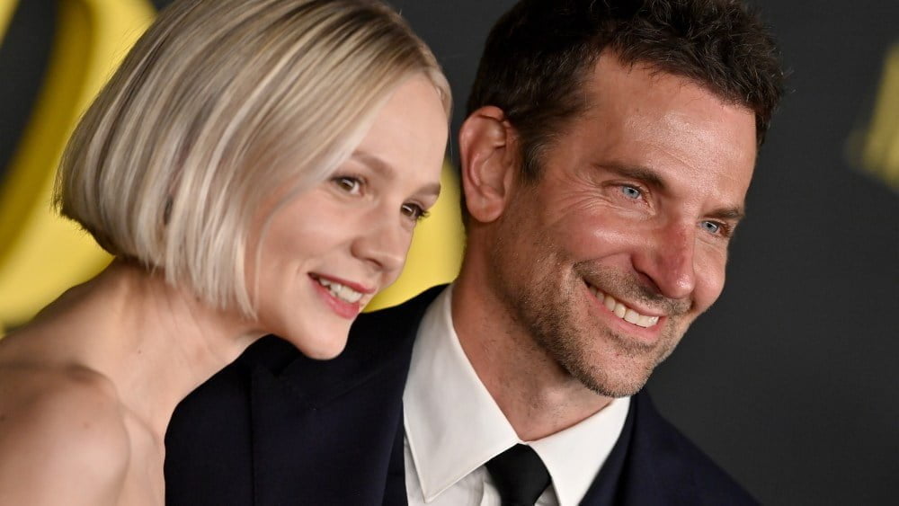 LOS ANGELES, CALIFORNIA - DECEMBER 12: Carey Mulligan and Bradley Cooper attend Netflix